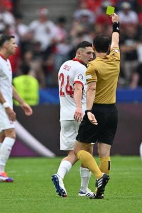 BERLIN, GERMANY - JUNE 21: Referee Umut Meler presents a yellow card to Bartosz Slisz of Poland during to the UEFA EURO, EM, Europameisterschaft,Fussball 2024 group stage match between Poland and Austria at Olympiastadion on June 21, 2024 in Berlin, G Poland v Austria: Group D - UEFA EURO 2024 Copyright: xSebastianxFrejx