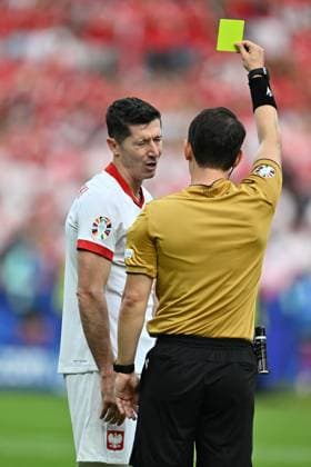 BERLIN, GERMANY - JUNE 21: Referee Umut Meler presents a yellow card to Robert Lewandowski of Poland during to the UEFA EURO, EM, Europameisterschaft,Fussball 2024 group stage match between Poland and Austria at Olympiastadion on June 21, 2024 in Berlin, G Poland v Austria: Group D - UEFA EURO 2024 Copyright: xSebastianxFrejx
