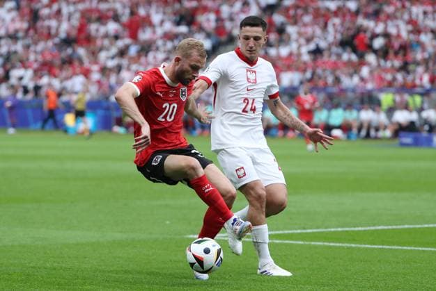 Konrad Laimer in a duel with Bartosz Slisz Sport Football Soccer European Championship Euro 2024 European Championship Men Season 2023 2024 21 06 2024 Poland POL vs Austria AUT in Berlin DFL regulations prohibit any use of photographs as image sequences and or quasi video