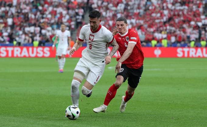 Jakub Moder in a duel with Marcel Sabitzer Sport Football Soccer European Championship Euro 2024 European Championship Men Season 2023 2024 21 06 2024 Poland POL vs Austria AUT in Berlin DFL regulations prohibit any use of photographs as image sequences and or quasi video