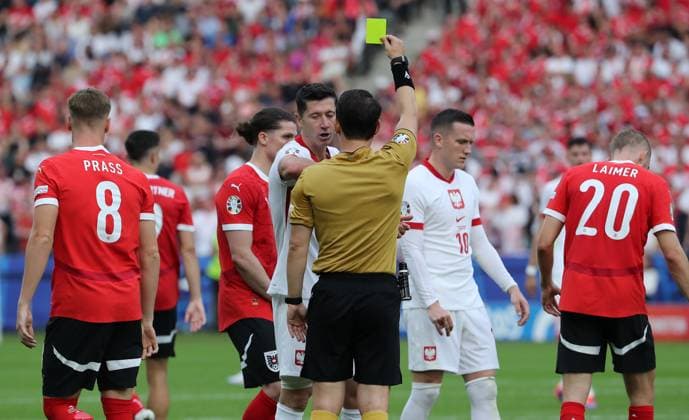 Referee Umut Meler TUR yellow card for Robert Lewandowski after foul on Philipp Lienhart Sport Football Soccer European Championship Euro 2024 European Championship Men Season 2023 2024 21 06 2024 Poland POL vs Austria AUT in Berlin DFL regulations prohibit any use of photographs as image sequences and or quasi video
