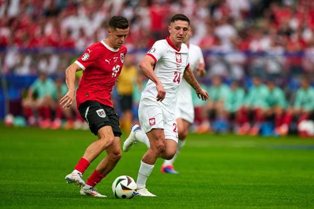 Christoph Baumgartner Austria national team Euro 2024, 19 , Bartosz Slisz Poland national team Euro 2024, 24 , GER, UEFA Euro 2024, mens football, UEFA European Championship 2024 match day 2, group D, Poland vs Oesterrech, Poland vs Austria, 21 06 2024 GER, UEFA Euro 2024, mens football, UEFA European Championship 2024 match day 2, group D, Poland vs Oesterrech, Poland vs Austria, 21 06 2024 Berlin Copyright: xEibner-Pressefotox xClaudiusxRauchx EP_CRH