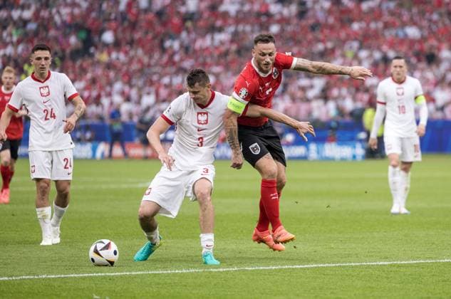 21st June 2024; Olympiastadion, Berlin, Germany; Euro 2024 Group D Football, Poland versus Austria; Pawel Dawidowicz (POL) holds off Marko Arnautovic (AUT)  ActionPlus12658318 FotoxOlimpik