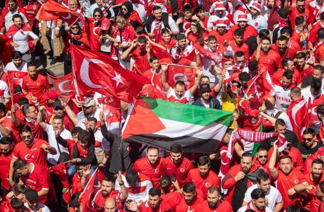 Football, Men, Season 2023 24, Euro 2024 Group F 2 Matchday in Dortmund, Turkey Portugal, Fan march of the Turkish fans, here with the flag of Palestine, 22 06 2024, Copyright: xSebastianxRäppold MatthiasxKochx