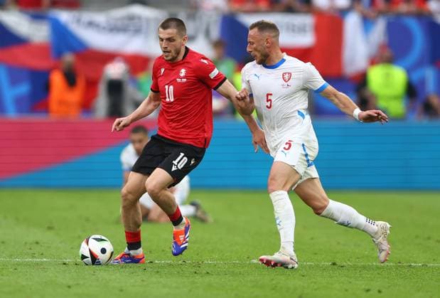 Giorgi Chakvetadze of Georgia is challenged by Vladimir Coufal of Czech Republic Georgia v Czechia, UEFA European Championship, EM, Europameisterschaft 2024, Group F, Football, Volksparkstadion, Hamburg, Germany, 22 Jun 2024 EDITORIAL USE ONLY No use with unauthorised audio, video, data, fixture lists, club league logos or live services. Online in-match use limited to 120 images, no video emulation. No use in betting, games or single club league player publications.  Copyright: xKieranxMcManus Shutterstockx 14548025ea