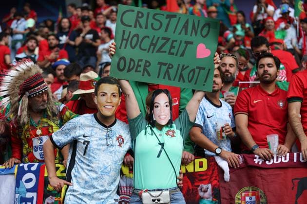 Euro 2024 Turkey Portugal on 22 06 2024 at the BVB stadium Dortmund in Dortmund The Portugal fans with CR7 Ronaldo mask and Georgina Rodriguez mask and a sign poster wedding or jersey MH
