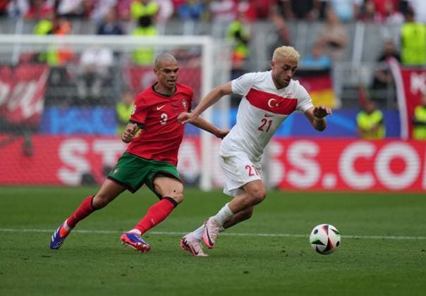 Baris Alper Yilmaz (R) and Pepe during UEFA EURO, EM, Europameisterschaft,Fussball 2024 Germany Group F football match between Turkiye and Portugal at BVB Stadion Dortmund in Dortmund, Germany, on 22 June, 2024. (Mehmet Topaloglu - Depo Photos) 18359977