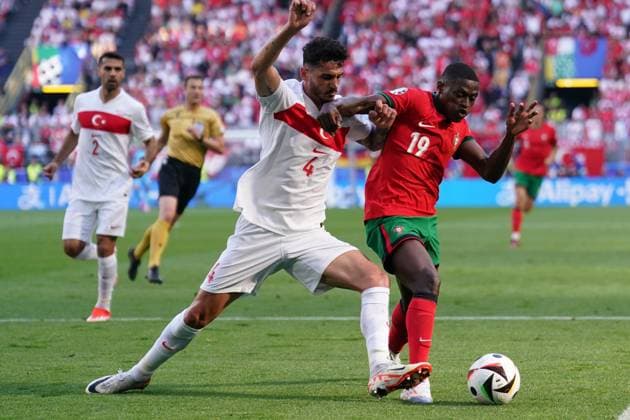 2024-06-22 Turkiye v Portugal - Group F - UEFA EURO, EM, Europameisterschaft,Fussball 2024 DORTMUND, GERMANY - JUNE 22: Samet Akaydin of Turkiye and Nuno Mendes of Portugal battles for the ball during the Group F - UEFA EURO 2024 match between Turkiye and Portugal at BVB Stadion Dortmund on June 22, 2024 in Dortmund, Germany. (Photo by Joris Verwijst BSR Agency) Dortmund Germany Content not available for redistribution in The Netherlands directly or indirectly through any third parties. Copyright: xBSRxAgencyx
