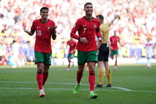 2024-06-22 Turkiye v Portugal - Group F - UEFA EURO, EM, Europameisterschaft,Fussball 2024 DORTMUND, GERMANY - JUNE 22: Joao Cancelo of Portugal. and Cristiano Ronaldo of Portugal celebrates after scoring the goal during the Group F - UEFA EURO 2024 match between Turkiye and Portugal at BVB Stadion Dortmund on June 22, 2024 in Dortmund, Germany. (Photo by Joris Verwijst BSR Agency) Dortmund Germany Content not available for redistribution in The Netherlands directly or indirectly through any third parties. Copyright: xBSRxAgencyx