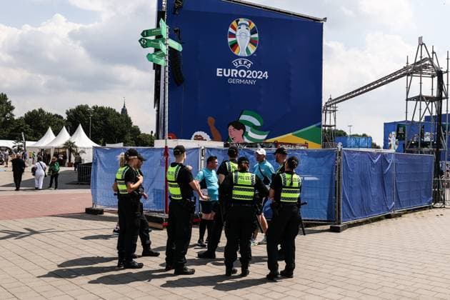 Sport, Soccer, UEFA EURO 2024 Group F 2 Matchday Georgia Czech Republic 22 06 2024, Fan Zone Heiligengeistfeld Police officers on the Heiligengeistfeld, in the background the logo of the UEFA EURO 2024 Hamburg Fan Zone Heiligengeistfeld Hamburg Germany