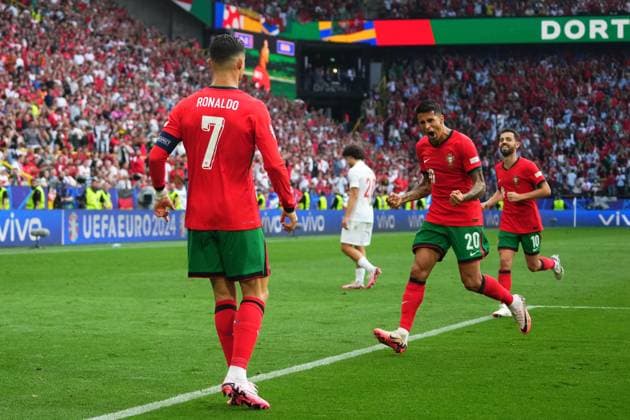 GER: Turkiye v Portugal. UEFA EURO, EM, Europameisterschaft,Fussball 2024 Cristiano Ronaldo of Portugal celebrates with his teammate Joao Cancelo the 0-3 scored by Bruno Fernandes during the UEFA Euro 2024 match between Turkiye and Portugal, Group F, date 2, played at Signal Iduna Park stadium on June 22, 2024 in Dortmund, Germany. kpng Copyright: xSergioxRuizx xPRESSINPHOTOx PS_240622_TUR_POR_061