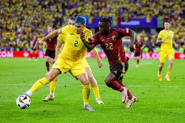 Belgium v Romania Euro 2024 22 06 2024. Group E Jeremy Doku of Belgium tussles with Andrei RaÈ›iu of Romania during the Euro 2024 match between Belgium and Romania at Cologne Stadium, Cologne, Germany on 22 June 2024. Editorial use only , Copyright: xNigelxKeenex PSI-19822-0016