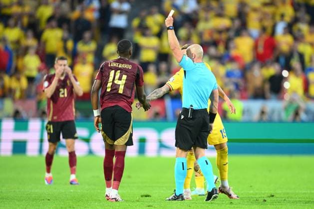 Belgium v Romania Group E - UEFA EURO, EM, Europameisterschaft,Fussball 2024 COLOGNE, GERMANY - JUNE 22 : Lukebakio Dodi forward of Belgium is shown a yellow card by referee Szymon Marciniak (POL) during the UEFA EURO 2024 European Football Championship tournament group E stage match between Belgium and Romania at Cologne Stadium on June 22, 2024 in Cologne, Germany, 22 06 2024 Cologne Germany  Copyright: xVincentxKalutx