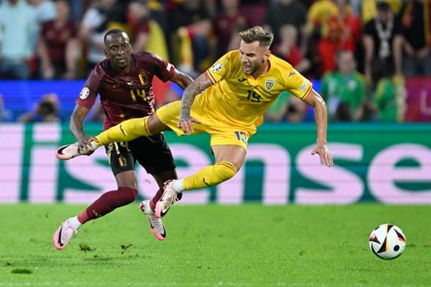 Belgium v Romania Group E - UEFA EURO, EM, Europameisterschaft,Fussball 2024 COLOGNE, GERMANY - JUNE 22 : Lukebakio Dodi forward of Belgium battles for the ball with Denis Dragus forward of Romania during the UEFA EURO 2024 European Football Championship tournament group E stage match between Belgium and Romania at Cologne Stadium on June 22, 2024 in Cologne, Germany, 22 06 2024 Cologne Germany  Copyright: xDhax