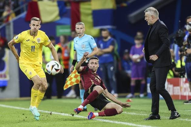 Romania s Nicusor Bancu, Belgium s Timothy Castagne and Romania s Head Coach Edward Iordanescu pictured during a soccer game between Belgian national soccer team Red Devils and Romania, Saturday 22 June 2024 in Cologne, Germany, the second match in the group stage of the UEFA EURO, EM, Europameisterschaft,Fussball 2024 European championships. BRUNOxFAHY  x95081443x