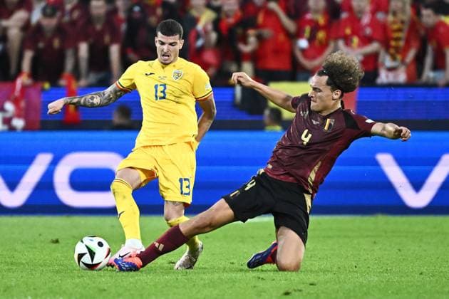 240622 EURO2024 BELGIUM VS ROMANIA Valentin Mihaila (13) of Romania battles for the ball with Wout Faes (4) of Belgium during a soccer game between the national teams of Belgium, called the Red Devils and Romania on the second matchday in Group E in the group stage of the UEFA EURO, EM, Europameisterschaft,Fussball 2024 tournament , on Saturday 22 June 2024 in Cologne , Germany . PHOTO Isosport Maarten Straetemans Cologne GERMANY  Copyright: xx 466914
