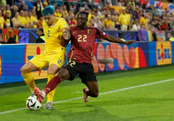 22 06 2024, Football, Euro 2024, Preliminary round, Belgium Romania, GER, Cologne, Cologne Stadium Picture from left Andrei Ratiu Romania, 2 and Jeremy Doku Belgium, 22 Copyright: HMBxMedia xHeikoxBecker