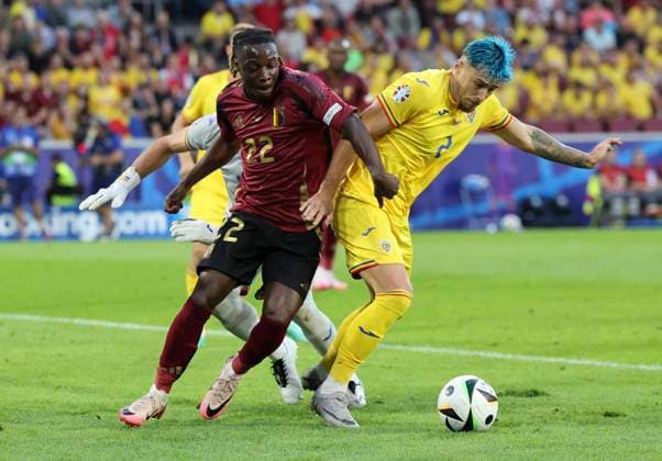 Belgium v Romania UEFA EURO, EM, Europameisterschaft,Fussball 2024 Group E JÃ rÃ my Doku of Belgium and Andrei RaÈ?iu of Romania in action during the UEFA Euro 2024 Group E match at RheinEnergieStadion, Cologne Copyright: xPaulxChestertonx FIL-20284-0050 UK Newspapers OUT