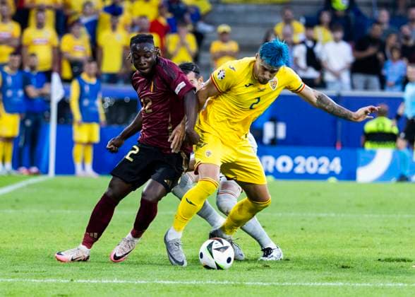 Koeln, RheinEnergieStadion, 22 06 2024 Jeremy Doku of belgium challenges Andrei Ratiu of romania during the match UEFA European Championship 2024 Belgium v Romania