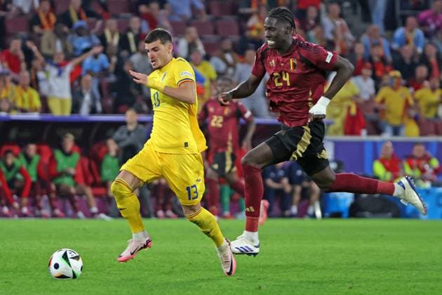 Goal chance Valentin Mihaila Romania, No. 13 in duel with Amadou Onana Belgium, No. 24 , Preliminary round match M22, BEL ROU, Group E, European Football Championship, Belgium vs Romania, European Football Championship, Belgium vs Romania, Cologne, 22 06 2024,