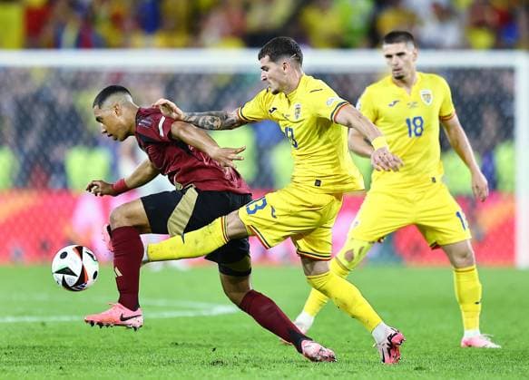 Youri Tielemans of Belgium and Valentin Mihaila of Romania Belgium v Romania, UEFA European Championship, EM, Europameisterschaft 2024, Group E, Football, Cologne Stadium, Cologne, Germany, 22 Jun 2024 EDITORIAL USE ONLY No use with unauthorised audio, video, data, fixture lists, club league logos or live services. Online in-match use limited to 120 images, no video emulation. No use in betting, games or single club league player publications. Copyright: xMichaelxZemanek Shutterstockx 14548045br