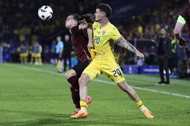 Belgium s Arthur Theate and Romania s Dennis Man fight for the ball during a soccer game between Belgian national soccer team Red Devils and Romania, Saturday 22 June 2024 in Cologne, Germany, the second match in the group stage of the UEFA EURO, EM, Europameisterschaft,Fussball 2024 European championships. BRUNOxFAHY  x95083646x