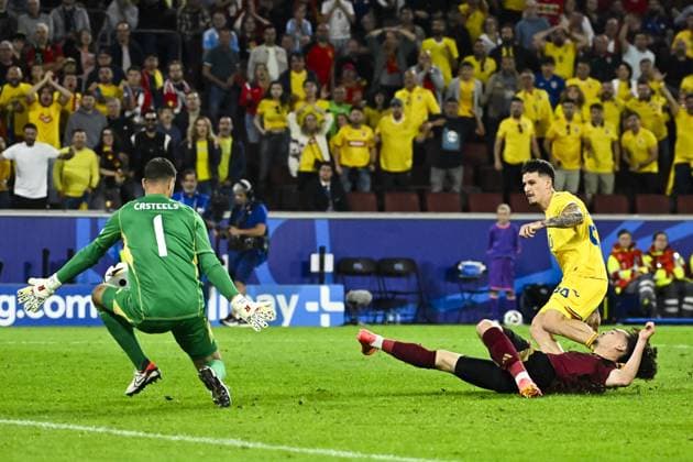 Belgium s goalkeeper Koen Casteels, Romania s Dennis Man and Belgium s Arthur Theate fight for the ball during a soccer game between Belgian national soccer team Red Devils and Romania, Saturday 22 June 2024 in Cologne, Germany, the second match in the group stage of the UEFA EURO, EM, Europameisterschaft,Fussball 2024 European championships. DIRKxWAEM  x95084507x