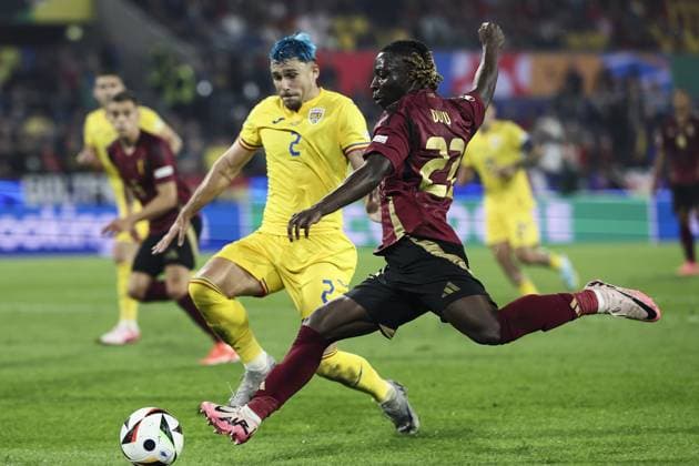 Romania s Andrei Ratiu and Belgium s Jeremy Doku fight for the ball during a soccer game between Belgian national soccer team Red Devils and Romania, Saturday 22 June 2024 in Cologne, Germany, the second match in the group stage of the UEFA EURO, EM, Europameisterschaft,Fussball 2024 European championships. BRUNOxFAHY  x95084526x