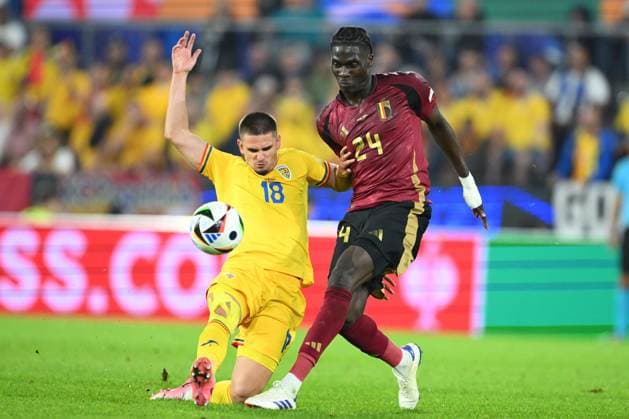 Belgium v Romania Group E - UEFA EURO, EM, Europameisterschaft,Fussball 2024 COLOGNE, GERMANY - JUNE 22 : Onana Amadou midfielder of Belgium in duel with Razvan Marin midfielder of Romania during the UEFA EURO 2024 European Football Championship tournament group E stage match between Belgium and Romania at Cologne Stadium on June 22, 2024 in Cologne, Germany, 22 06 2024 Cologne Germany  Copyright: xVincentxKalutx