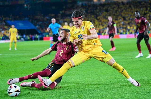 Zeno Debast Belgium and Ianis Hagi Romania in a duel, UEFA EURO 2024 Group E, Belgium vs Romania, Cologne Stadium on June 22, 2024 in Cologne, Germany Photo by Silas Schueller DeFodi Images Zeno Debast Belgium and Ianis Hagi Romania battle for the ball, UEFA EURO 2024 Group E, Belgium vs Romania, Cologne Stadium on June 22, 2024 in Cologne, Germany Photo by Silas Schueller DeFodi Images Defodi 738 738 BELROU 20240622 266 Defodi-738