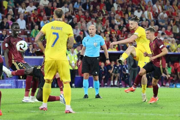 Belgium v Romania UEFA EURO, EM, Europameisterschaft,Fussball 2024 Group E Radu DrÄ?guÈ?in of Romania has a shot on goal during the UEFA Euro 2024 Group E match at RheinEnergieStadion, Cologne Copyright: xPaulxChestertonx FIL-20284-0207 UK Newspapers OUT