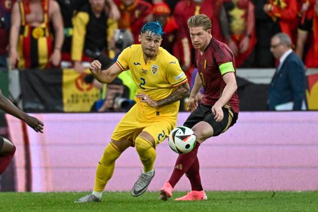 from left in duel Andrei Ratiu 2 of Romania Kevin De Bruyne 7 of Belgium 22 06 2024 European Football Championship in Germany Belgium vs Romania , Rheinenergiestadion, Koeln, NRW Germany Copyright: xpepphotox xHorstxMauelshagenx pep00321, pep_20240622_hm
