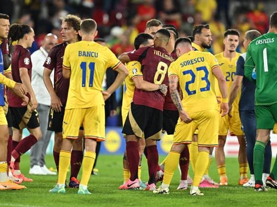 Nicolae Stanciu and Youri Tielemans, former RSC Anderlecht teammates, embrace as Wout Faes looks on after the UEFA EURO 2024 football match between Belgium and Romania at the Cologne Stadium in Cologne, Saturday 22 June 2024 Cologne Copyright: xRazvanxPasarica SPORTxPICTURESx