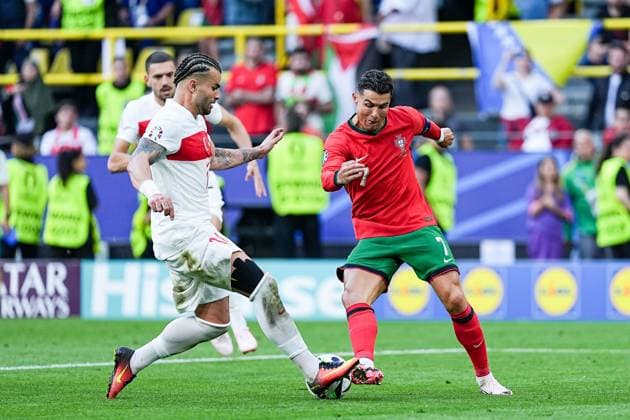 Dortmund, Germany, June 22th 2024: Abdulkerim BardakcÄ± (14 Turkiye) and Cristiano Ronaldo (7 Portugal) battle for the ball (duel) during the UEFA EURO, EM, Europameisterschaft,Fussball 2024 Germany Group F football match between Turkiye and Portugal at BVB Stadion Dortmund in Dortmund, Germany. (Daniela Porcelli SPP)  Copyright: xDanielaxPorcellix xSPPx spp-en-DaPoSp-20240622-DP203092