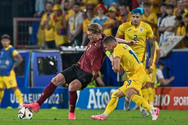 from left in duel Kevin De Bruyne 7 of Belgium Razvan Marin 18 of Romania 22 06 2024 European Football Championship in Germany Belgium vs Romania , Rheinenergiestadion, Koeln, NRW Germany Copyright: xpepphotox xHorstxMauelshagenx pep00321, pep_20240622_hm