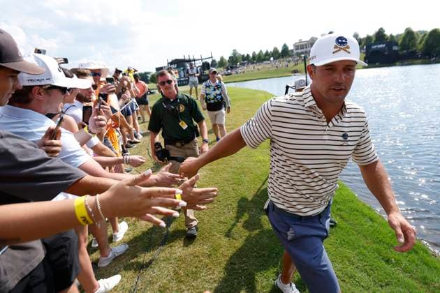 COLLEGE GROVE, TN - JUNE 22: Bryson DeChambeau (USA) of Crushers GC gives fans a high five as he walks off No. 18 during the second round of LIV Golf Nashville, June 22, 2024, at The Grove in College Grove, Tennessee. (Photo by Matthew Maxey Icon Sportswire) GOLF: JUN 22 LIV Golf League Nashville EDITORIAL USE ONLY Icon24062261