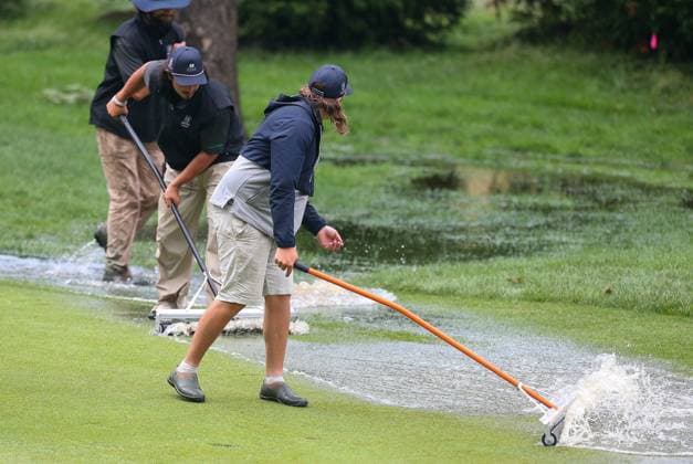 CROMWELL, CT - JUNE 22: Workers clear the 10th fairway of water during the third round of the 2024 Travelers Championship on June 22, 2024, at TPC River Highlands in Cromwell, CT. (Photo by M. Anthony Nesmith Icon Sportswire) GOLF: JUN 22 PGA, Golf Herren Travelers Championship EDITORIAL USE ONLY Icon240622492024