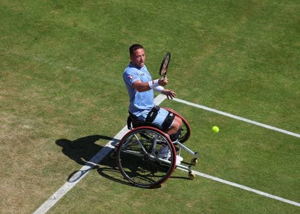 23rd June 2024; Cinch Championships, Queens Club, West Kensington, London, England: Cinch Championships Queens Club, Day 7; Alfie Hewett (GBR) with a forehand shot to Gordon Reid (GBR), mens wheelchair singles final match  ActionPlus12659086 JohnxPatrickxFletcher