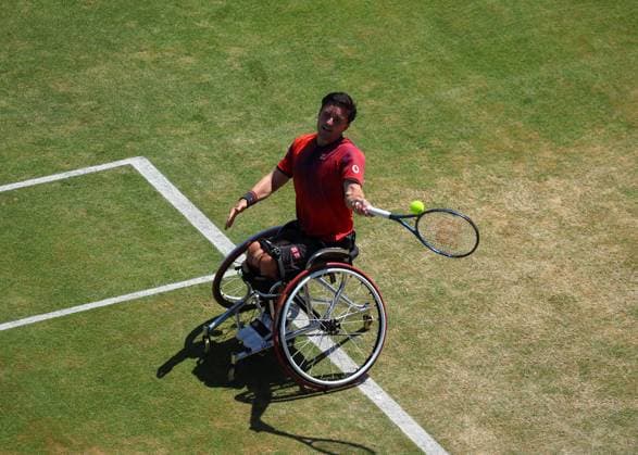 23rd June 2024; Cinch Championships, Queens Club, West Kensington, London, England: Cinch Championships Queens Club, Day 7; Gordon Reid (GBR) with a forehand shot to Alfie Hewett (GBR), mens wheelchair singles final match  ActionPlus12659096 JohnxPatrickxFletcher