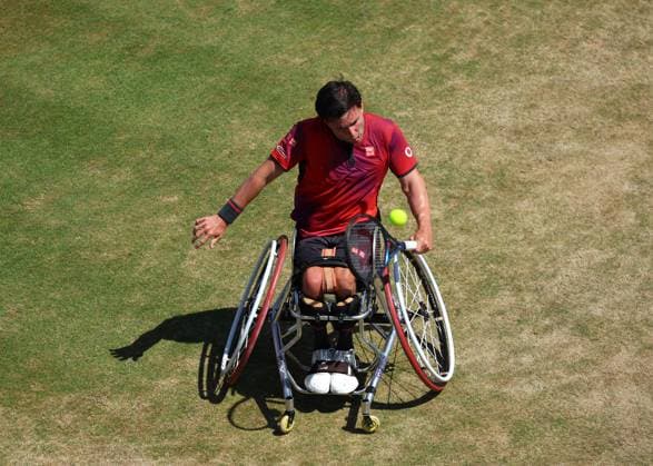 23rd June 2024; Cinch Championships, Queens Club, West Kensington, London, England: Cinch Championships Queens Club, Day 7; Gordon Reid (GBR) with a backhand shot to Alfie Hewett (GBR), mens wheelchair singles final match  ActionPlus12659099 JohnxPatrickxFletcher