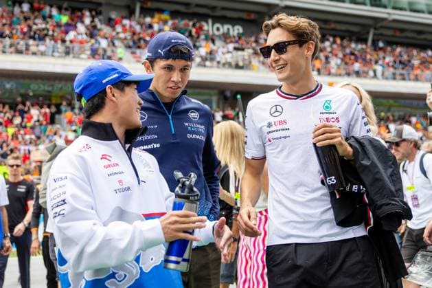BARCELONA, SPAIN - JUNE 23: Yuki Tsunoda (22) of Japan and team Visa Cash App RB F1 Team, Alexander Albon (23) of Thailand and team Williams Racing and George Russell (63) of United Kingdom and team Mercedes-AMG Petronas F1 Team talk before the Formula 1 Spanish Grand Prix on Sunday, June 23, 2024 at the Circuit De Catalunya in Barcelona, Spain. (Photo by Bob Kupbens Icon Sportswire) AUTO: JUN 23 F1 Spanish Grand Prix EDITORIAL USE ONLY Icon240623060