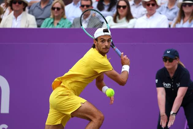 23rd June 2024; Cinch Championships, Queens Club, West Kensington, London, England: Cinch Championships Queens Club, Day 7; Lorenzo Musetti (ITA) with a backhand shot to Tommy Paul (USA), mens singles final match  ActionPlus12659180 JohnxPatrickxFletcher