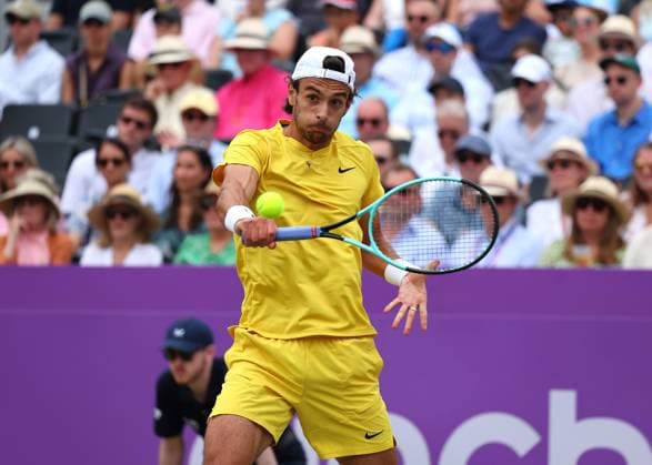 23rd June 2024; Cinch Championships, Queens Club, West Kensington, London, England: Cinch Championships Queens Club, Day 7; Lorenzo Musetti (ITA) with a backhand shot to Tommy Paul (USA), mens singles final match  ActionPlus12659183 JohnxPatrickxFletcher