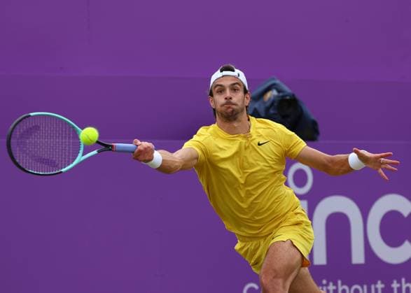 23rd June 2024; Cinch Championships, Queens Club, West Kensington, London, England: Cinch Championships Queens Club, Day 7; Lorenzo Musetti (ITA) with a forehand shot to Tommy Paul (USA), mens singles final match  ActionPlus12659185 JohnxPatrickxFletcher