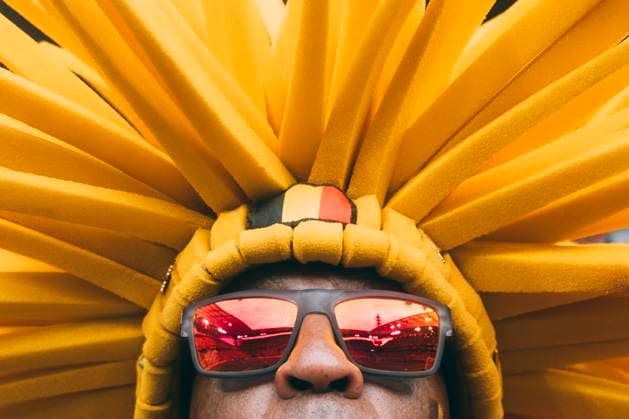 Koeln, RheinEnergieStadion, 22 06 2024 Fan from belgium with fries hat and reflection of the stadium in his sun glasses prior the match UEFA European Championship 2024 Belgium v Romania