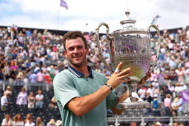23rd June 2024; Cinch Championships, Queens Club, West Kensington, London, England: Cinch Championships Queens Club, Day 7, mens singles final; Tommy Paul (USA) lifts the Queens Club trophy after defeating Lorenzo Musetti (ITA) in two sets  ActionPlus12659299 JohnxPatrickxFletcher