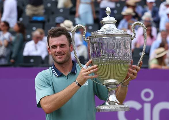 23rd June 2024; Cinch Championships, Queens Club, West Kensington, London, England: Cinch Championships Queens Club, Day 7, mens singles final; Tommy Paul (USA) lifts the Queens Club trophy after defeating Lorenzo Musetti (ITA) by two sets  ActionPlus12659305 JohnxPatrickxFletcher