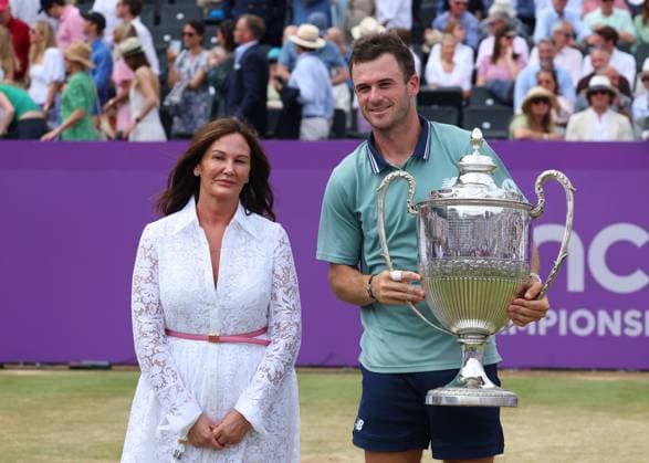 23rd June 2024; Cinch Championships, Queens Club, West Kensington, London, England: Cinch Championships Queens Club, Day 7, mens singles final; Tommy Paul (USA) poses with the Queens Club trophy next to Chairmen of Constellation Automotive Group Avril Palmer-Baunack  ActionPlus12659310 JohnxPatrickxFletcher