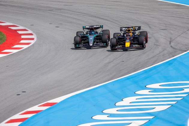 BARCELONA, SPAIN - JUNE 23: Max Verstappen (1) of Netherlands and team Oracle Red Bull Racing passes George Russell (63) of United Kingdom and team Mercedes-AMG Petronas F1 Team to take the lead during the Formula 1 Spanish Grand Prix on Sunday, June 23, 2024 at the Circuit De Catalunya in Barcelona, Spain. (Photo by Bob Kupbens Icon Sportswire) AUTO: JUN 23 F1 Spanish Grand Prix EDITORIAL USE ONLY Icon240623079