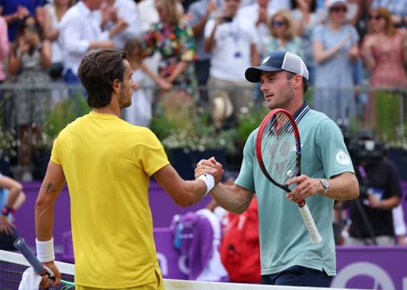 23rd June 2024; Cinch Championships, Queens Club, West Kensington, London, England: Cinch Championships Queens Club, Day 7, mens singles final; Tommy Paul (USA) shakes hands with Lorenzo Musetti (ITA) after defeating the Italian in two sets, mens singles match  ActionPlus12659317 JohnxPatrickxFletcher